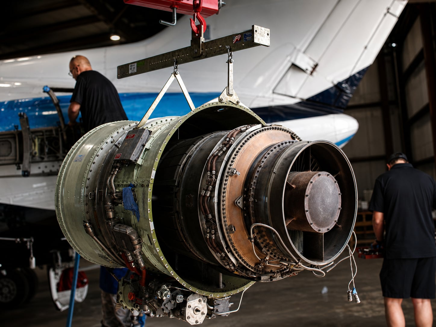Disassembled business jet engine on a stand during a heavy maintenance event